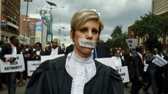 Silenced by injustice: one lawyer marched in silence with a piece of masking tape over her mouth
