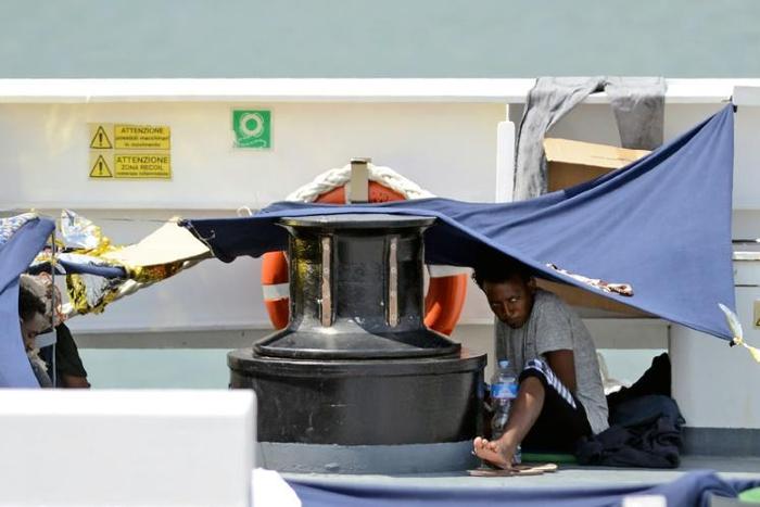Migrants aboard the Italian coastguard ship, Diciotti, last August