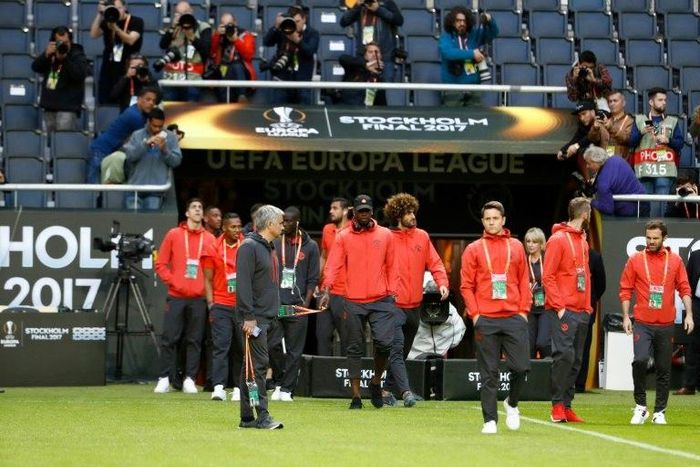 Manchester United's Portuguese manager Jose Mourinho (2nd L) and his players arrive to inspect the pitch at the Friends Arena in Solna outside Stockholm on May 23, 2017