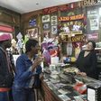 Migrants from Senegal and Niger joke with the waitress in the main bar of Sant' Alessio in Aspromonte, a small village of 330 inhabitants in Calabria, southern Italy