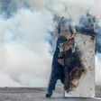 Demonstrators clash with riot police in the latest of a series of violent protests over the economic crisis gripping Venezuela