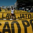 Demonstrators march along Copacabana Beach in Rio de Janeiro, Brazil, on March 26, 2017 during a nationwide protest against political corruption