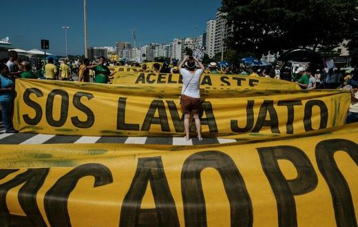 Demonstrators march along Copacabana Beach in Rio de Janeiro, Brazil, on March 26, 2017 during a nationwide protest against political corruption