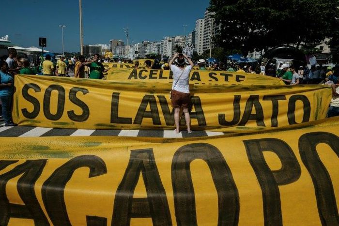 Demonstrators march along Copacabana Beach in Rio de Janeiro, Brazil, on March 26, 2017 during a nationwide protest against political corruption