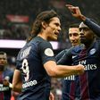 Paris Saint-Germain's Edinson Cavani (L) is congratulated by teammates after scoring a goal during their French L1 football match against Montpellier at the Parc des Princes stadium in Paris on April 22, 2017