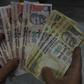 The 500 and 1000 rupee ($7.50, $15) bills -- amount to 85 percent of the cash in circulation across India