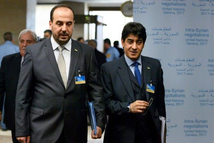 Syrian main opposition High Negotiations Committee (HNC) chief negotiator Mohamad Sabra (R) and leader Nasr al-Hariri arrive for a meeting with UN Special Envoy during Syria peace talks in Geneva on February 27, 2017