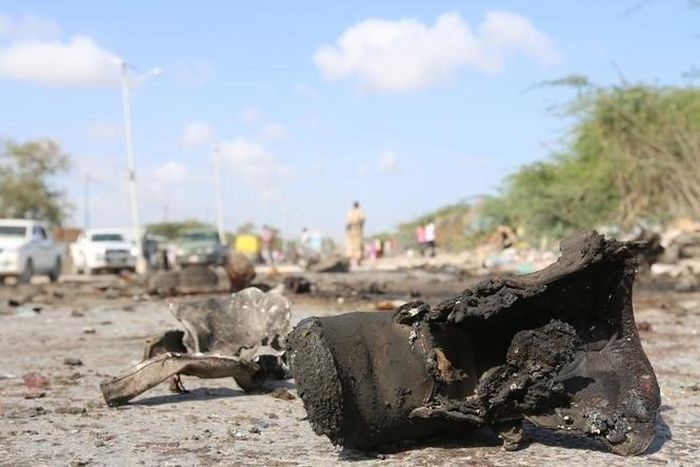 A military boot is seen at the scene of a suicide car bomb attack by al Shabaab in Somalia's capital Mogadishu, Somalia, September 18, 2016. REUTERS/Feisal Omar