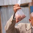Kenya's githeri man holding his githeri (Courtesy)