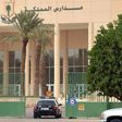 A police car passes through the main entrance of the Kingdom School in Riyadh on May 31, 2017
