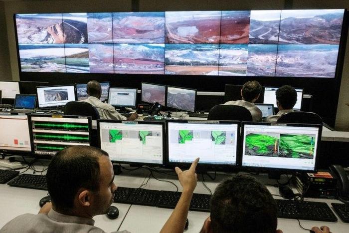 Employees of Brazilian mining company Samarco monitor rebuilding sites at the security control room in their mining site in Mariana, Minas Gerais State, southern Brazil, on October 26, 2016