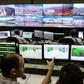 Employees of Brazilian mining company Samarco monitor rebuilding sites at the security control room in their mining site in Mariana, Minas Gerais State, southern Brazil, on October 26, 2016