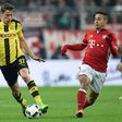 Dortmund's Erik Durm (left) and Bayern Munich's Thiago Alcantara in action during the German Cup semi-final match in Munich, on April 26, 2017