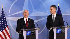 NATO Secretray General Jens Stoltenberg (R) and US Vice-President Mike Pence (L) give a press conference after a meeting at the NATO headquarters in Brussels on February 20, 2017