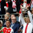 Arsenal's French manager Arsene Wenger lifts the FA Cup trophy after their win over Chelsea in the English FA Cup final football match between Arsenal and Chelsea at Wembley stadium in London on May 27, 2017