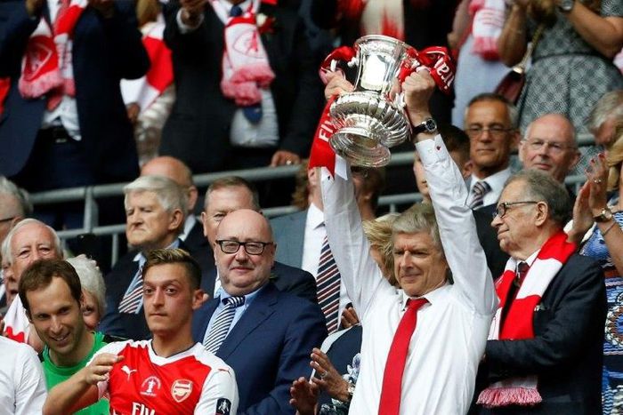 Arsenal's French manager Arsene Wenger lifts the FA Cup trophy after their win over Chelsea in the English FA Cup final football match between Arsenal and Chelsea at Wembley stadium in London on May 27, 2017