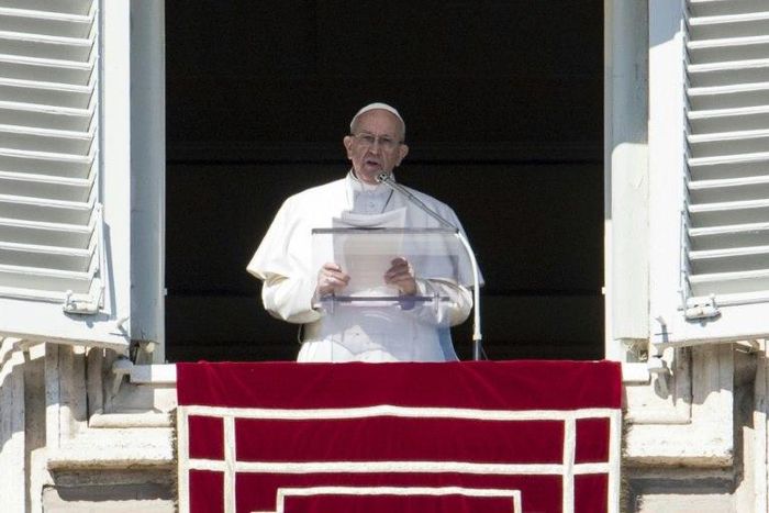 Pope Francis addresses the crowd from the window of the apostolic palace overlooking St. Peter's Square in Vatican City, on February 19, 2017