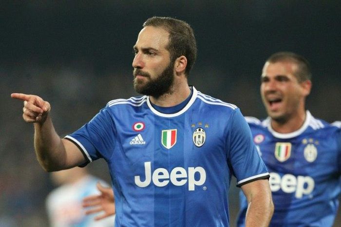 Juventus forward Gonzalo Higuain celebrates after scoring during the Italian Cup semi-final second leg against Napoli at the San Paolo Stadium on April 5, 2017