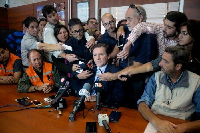 San Juan's province Mining Minister Alberto Hensel (C) speaking during a press conference in San Juan, west of Argentina on March 30, 2017