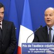 Francois Fillon (left) listens to Marc Ladreit de Lacharriere during a 2009 award ceremony in Paris