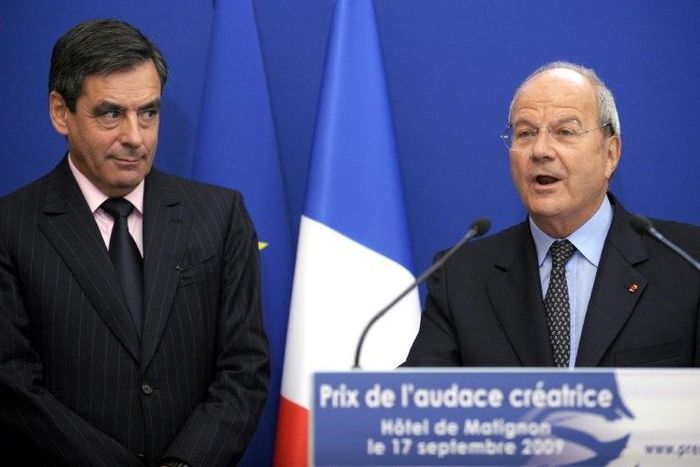 Francois Fillon (left) listens to Marc Ladreit de Lacharriere during a 2009 award ceremony in Paris