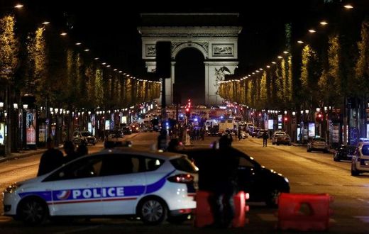 The gunman opened fire on a police van just a few hundred metres from the iconic Arc de Triomphe