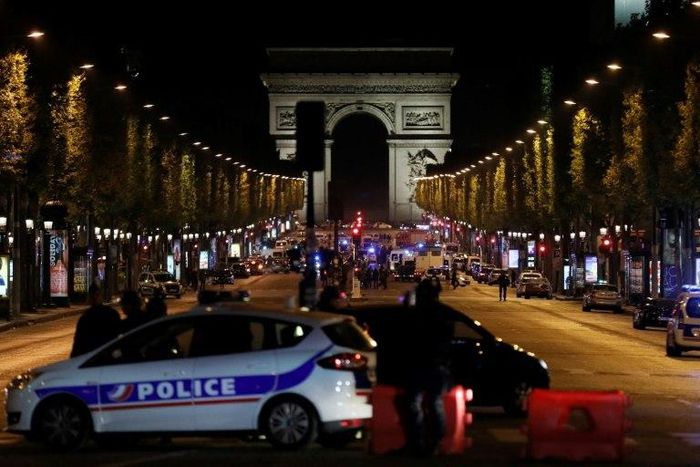 The gunman opened fire on a police van just a few hundred metres from the iconic Arc de Triomphe