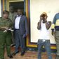 Julius Mwithalii (in handcuffs) after he was arrested for clinging on to Raila's chopper in Meru.