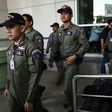A Thai police forensics team leaves a Bangkok hospital that was struck by a small bomb on May 22, 2017