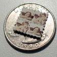 LSD blotter tabs on a US quarter coin, used as part of an illegal and potentially risky trend, of taking tiny amounts of psychedelic drugs too boost work or treat ailments