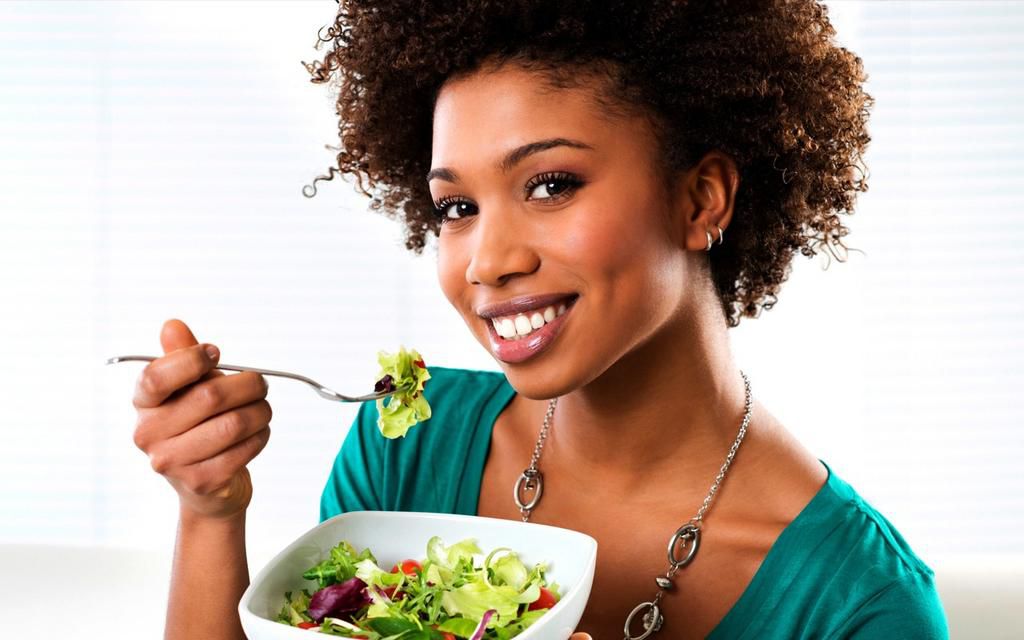 Woman eating vegetables(ebony)