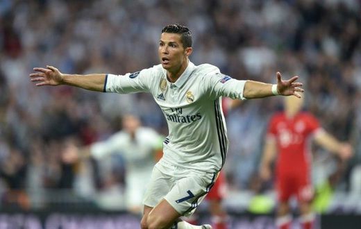 Real Madrid's striker Cristiano Ronaldo celebrates after his second goal during the UEFA Champions League quarter-final second leg football match Real Madrid vs FC Bayern Munich at the Santiago Bernabeu stadium in Madrid in Madrid on April 18, 2017