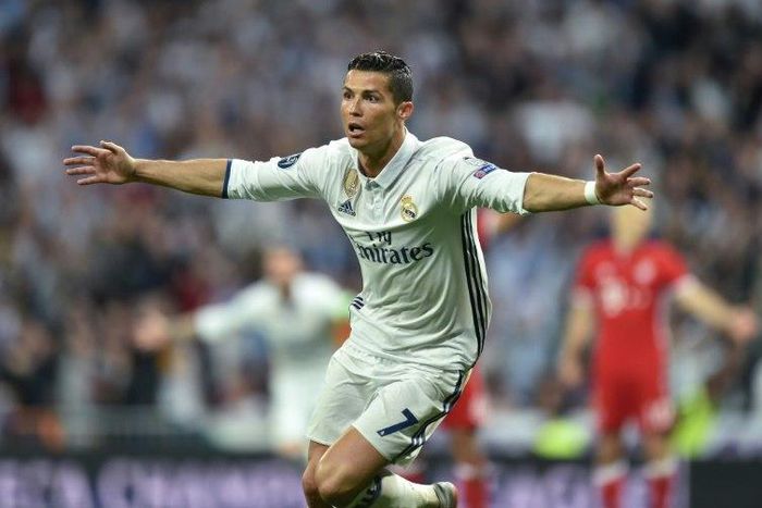 Real Madrid's striker Cristiano Ronaldo celebrates after his second goal during the UEFA Champions League quarter-final second leg football match Real Madrid vs FC Bayern Munich at the Santiago Bernabeu stadium in Madrid in Madrid on April 18, 2017
