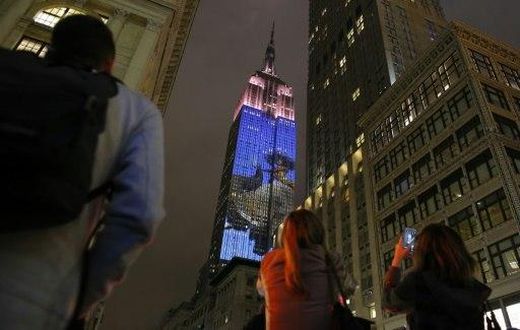 New York's famed Empire State Building celebrates the 150th anniversary of style magazine Harper's Bazaar with projections of iconic fashion photos