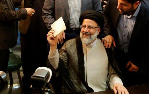 Iranian cleric Ebrahim Raisi gestures after registering his candidacy for the upcoming presidential elections at the ministry of the interior in Tehran on April 14, 2017