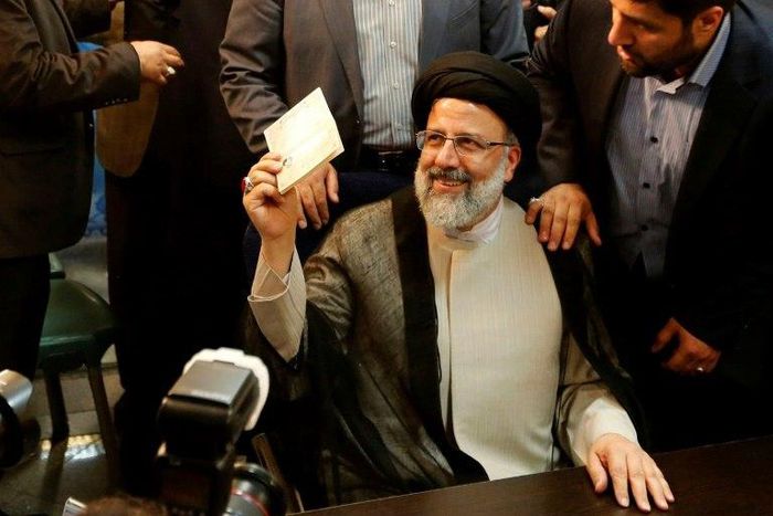 Iranian cleric Ebrahim Raisi gestures after registering his candidacy for the upcoming presidential elections at the ministry of the interior in Tehran on April 14, 2017