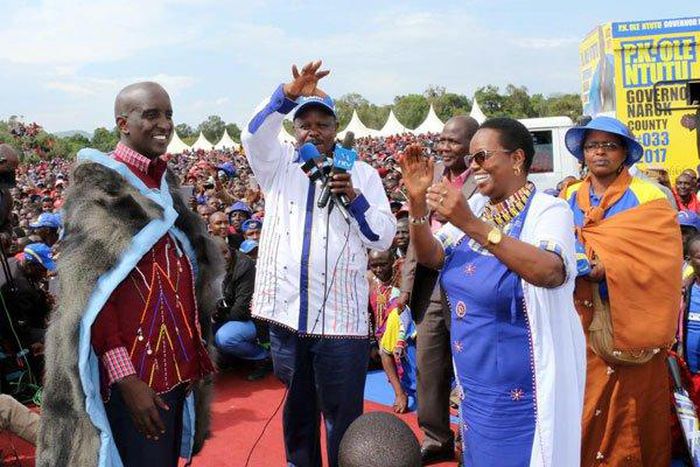 Narok West MP Patrick Ntutu (left) is welcomed to CCM party by leader Isaac Ruto (center) as Ms Lydia Ntimama looks on.