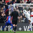 Watford's striker Troy Deeney (C) scores an own goal during the English Premier League football match against Crystal Palace March 18, 2017