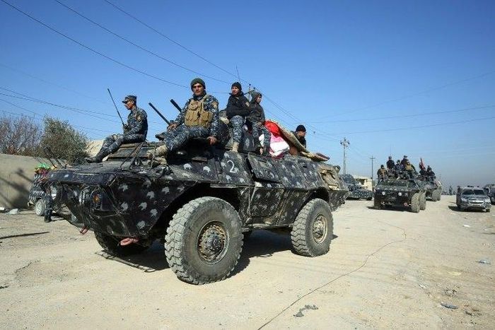 Iraqi security forces advance towards the the village of al-Buseif on February 21, during their offensive to retake western Mosul