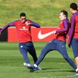England defender Chris Smalling (L) and teammate Phil Jones take part in a training session at St George's Park in Burton-on-Trent, central England on March 21, 2017