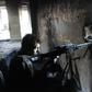 A member of Syria's pro-government forces guards a look out point as they advance Aleppo's rebel-held Bustan al-Basha neighbourhood on October 6, 2016