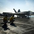 A F/A-18E Super Hornet launches from the flight deck of the Nimitz-class aircraft carrier USS Carl Vinson