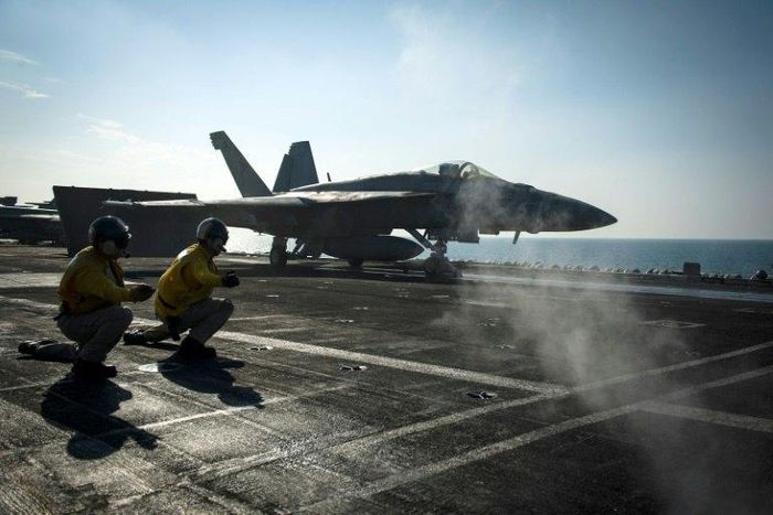 A F/A-18E Super Hornet launches from the flight deck of the Nimitz-class aircraft carrier USS Carl Vinson