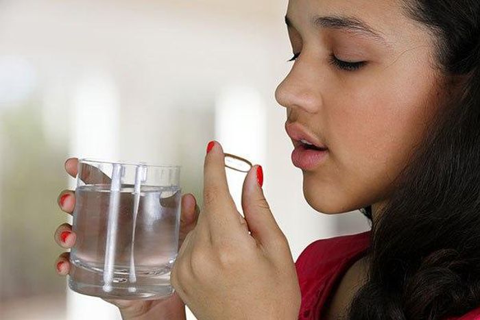 Woman taking a laxative