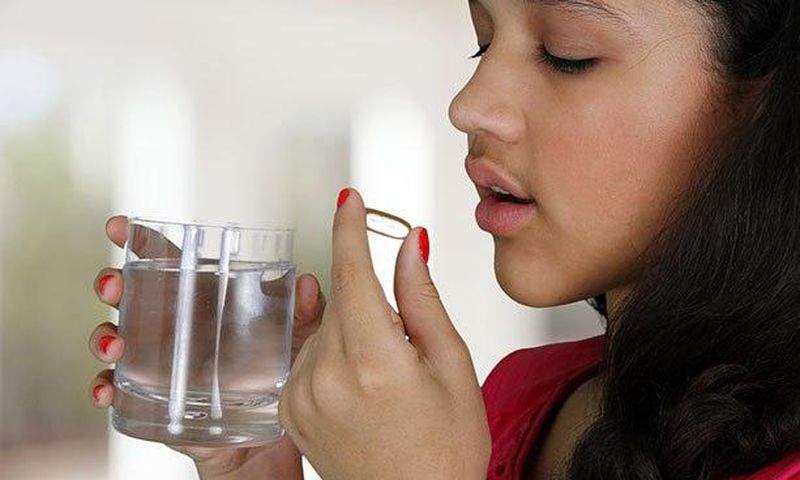 Woman taking a laxative