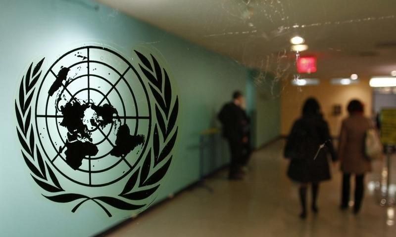 The United Nations logo is displayed on a door at U.N. headquarters in New York February 26, 2011. REUTERS/ Joshua Lott