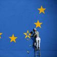 A recently painted mural by British graffiti artist Banksy, depicting a workman chipping away at one of the stars on a European Union flag