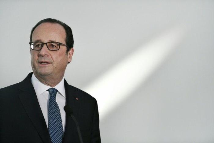 French President Francois Hollande holds a press conference during a visit of The Louvre Abu Dhabi on December 3, 2016