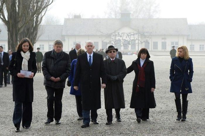 US Vice President Mike Pence (3rd left) and his family are joined by ex-Dachau prisoners as they visit the Dachau concentration camp in southwestern Germany, on February 19, 2017