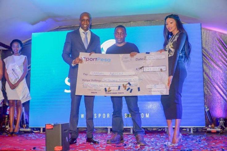 Samuel Abisai receiving  his cheque